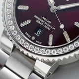 Close-up of the red dial on the Oris Aquis Date Relief 41.50cmm Automatic Watch 733 7766 4998MB, showing the 44 set diamonds and Superluminova-treated hands and indices. The diamond-set case detail is shown up close.