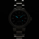 Lume display of the Oris Aquis Date Relief 41.50cmm Automatic Watch 733 7766 4998MB, showing the Superluminova-treated hands and indices illuminated for readability in low-light conditions.