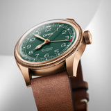 Three-quarter angle view of the Oris Big Crown Limited Edition Men's 40mm Bronze Automatic Watch 754 7741 3167LS, highlighting the fluted bronze bezel and domed sapphire crystal. The green dial and pointer date function are visible from this angle.