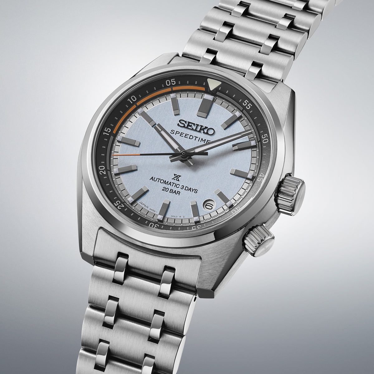 The Seiko Prospex Speedtimer Men’s 39.50mm Watch HBC003J reveals the dial’s applied indexes, Prospex logo and orange seconds hand in close detail. The date window sits at 4:30.