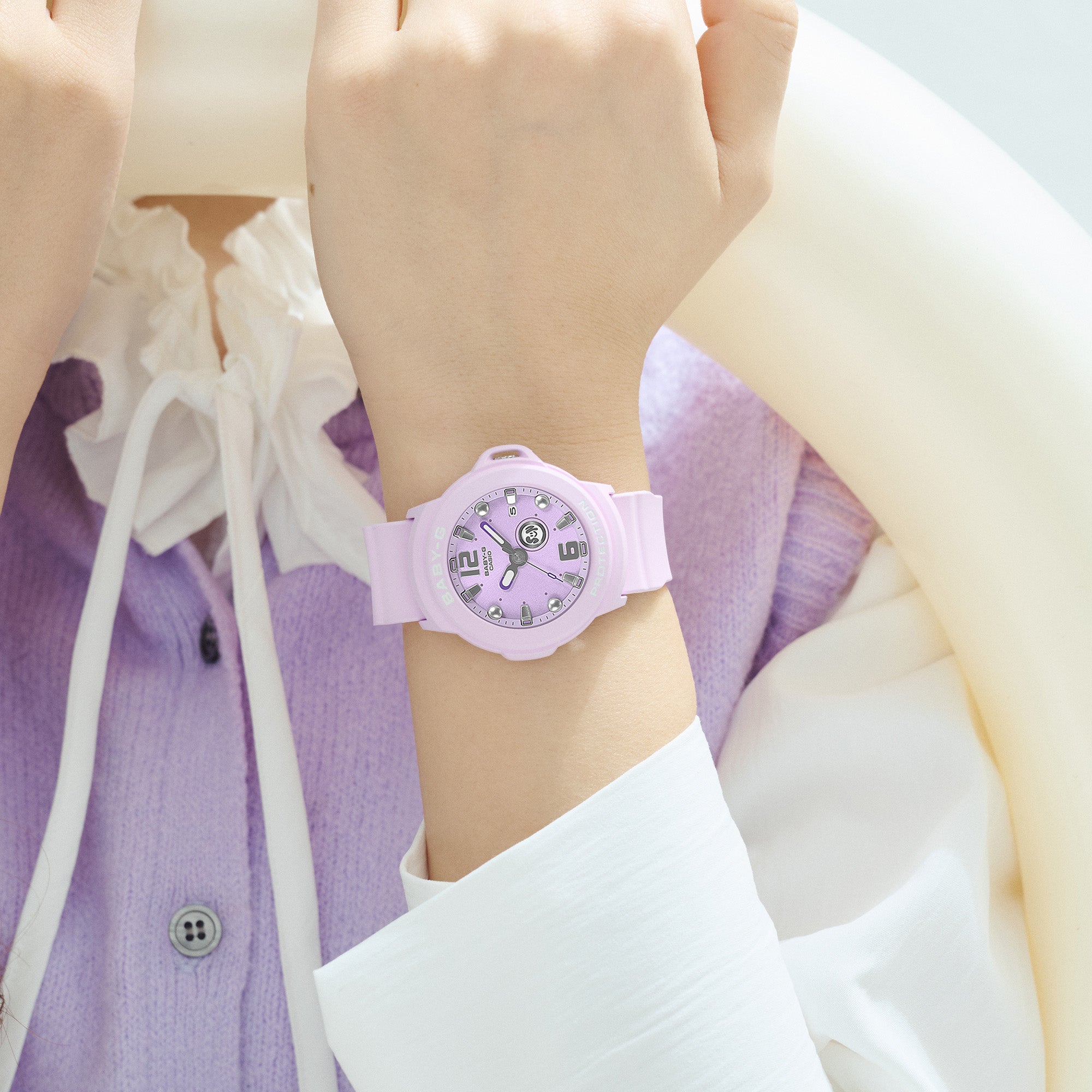 Casio Baby-G BGA15K-6A front view showcasing the soft pastel purple matte bezel and band with shimmering metal dial - on wrist