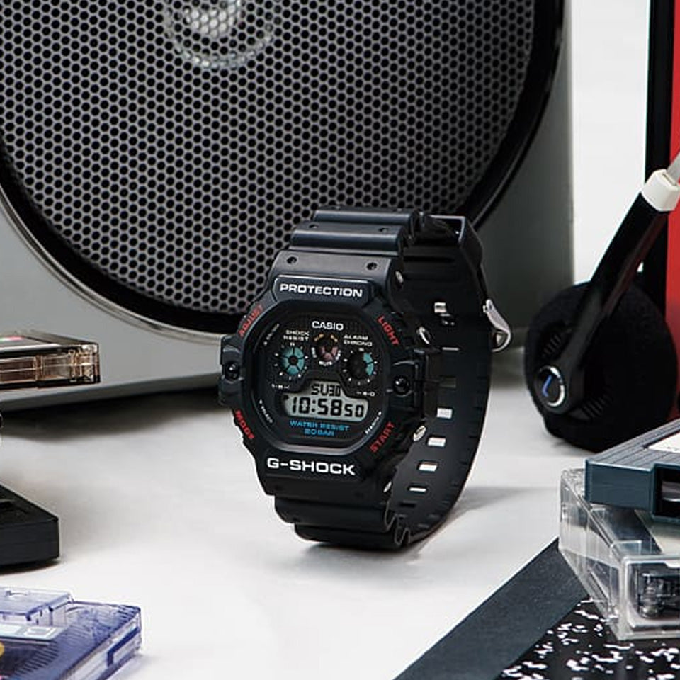 Casio G-SHOCK DW5900-1D digital watch with black resin band, triple graph display, and shock-resistant retro design.