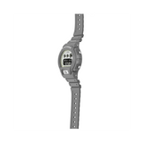 Casio G-SHOCK DW6900HD-8D digital watch with grey resin band, black LCD display, triple graph face, and shock-resistant design.