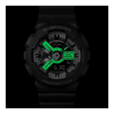 Lume on the Casio G-SHOCK GA110HD-8A analogue digital watch with grey resin band, layered black dial, and shock-resistant oversized design.