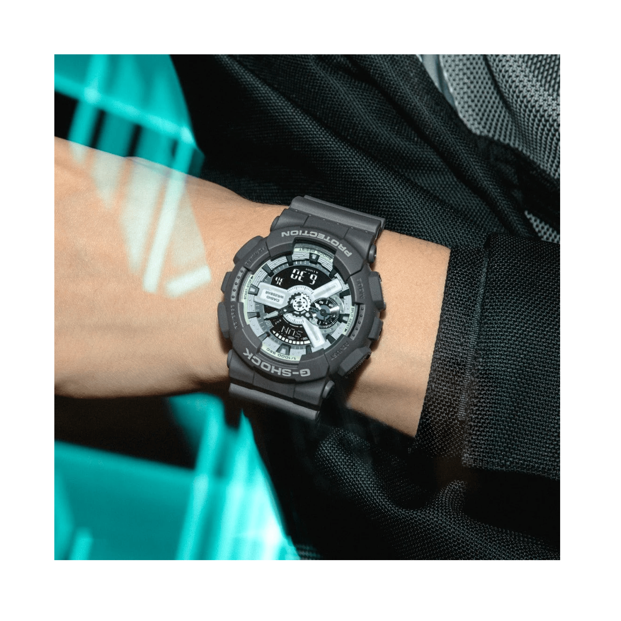 Casio G-SHOCK GA110HD-8A analogue digital watch with grey resin band, layered black dial, and shock-resistant oversized design - on hand