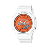 Casio G-SHOCK GMA-S2100WS-7A analogue digital watch with white resin band, metallic orange dial, octagonal bezel, and shock-resistant design.