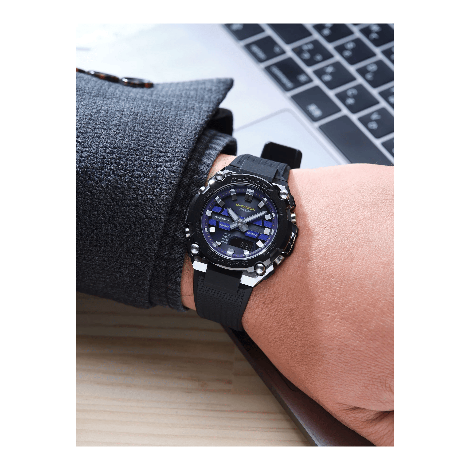 Casio G-SHOCK GSTB600A-1A6 analogue digital solar watch with black resin band, purple dial, stainless steel bezel, and Bluetooth connectivity - on hand