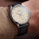 The Timex Waterbury Traditional Quartz 39mm Watch TW2Y92000 pairs its polished silver-tone stainless steel case with a black leather strap for a classic, considered look. The white dial adds a crisp contrast against the black strap.