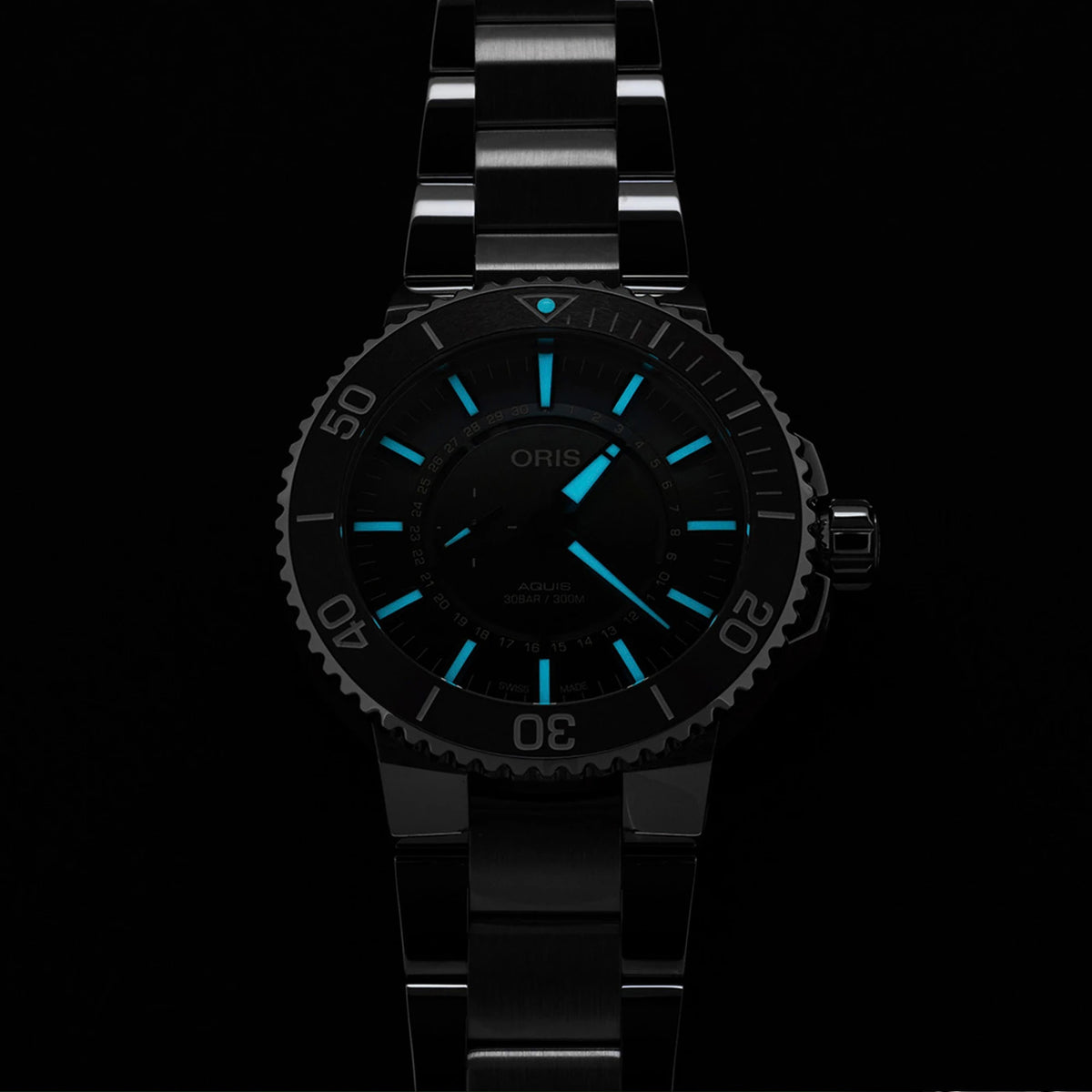 Oris Aquis Dat Watt Limited Edition II Men’s Automatic 43.50mm Watch 743 7734 4197-SET glowing in low light, with luminous hands and markers.