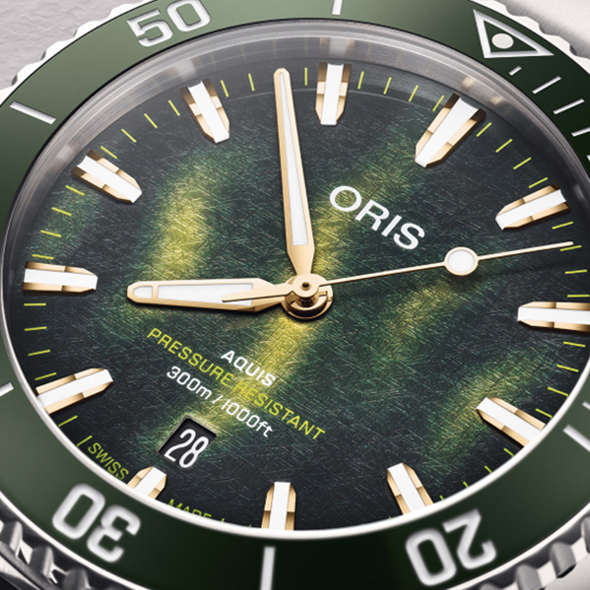 Oris Kelp Forest Aquis Limited Edition 41.50mm Men’s Automatic Watch 733 7787 4187SET — Close-up of the 3D-printed kelp-textured green and gold dial with luminous golden-outlined hands and applied hour markers.