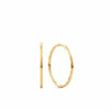 A pair of 9ct yellow gold sleeper hoop earrings zi shown front on, displaying their compact 10mm round silhouette with a polished finish and slim 1mm width.