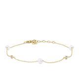 Front-on view of the Wallace Bishop Freshwater Pearl & Cubic Zirconia Bezel Bracelet in 9ct Yellow Gold, reference 33BLCZ06Y, on a cable chain with a parrot clasp. The bracelet features stationed round freshwater pearls and bezel-set round cubic zirconias.