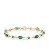 Front-on view of the Wallace Bishop 0.06 TDW Created Emerald & Diamond Bracelet in 9ct Yellow Gold, reference 34BLE16, 180mm in length with a lobster clasp. Green oval and round created emeralds alternate along the polished gold links, with small round diamonds between them.