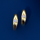 Front-on view of the Wallace Bishop Opal Starburst Huggies in 9ct Yellow Gold, reference 36ERSBOY, measuring 14.50mm in length. Each huggie holds a 2.5mm round white opal in a star hammer setting.