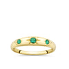 Front-on view of the Wallace Bishop Created Emerald Starburst Ring in 9ct Yellow Gold, reference 38RGSBEYO. Three round created emeralds sit in a star hammer setting across the front of the tapered gold ring.