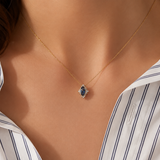Bluebird™ London Blue Topaz & Diamond Marquise Halo Pendant with Chain in 9ct Yellow Gold