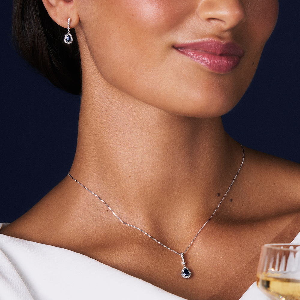 Bluebird™ Sapphire & 0.22ct Diamond Pear Halo Pendant with Chain in 9ct White Gold