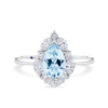 1917™ aquamarine and 0.52ct TW diamond halo engagement ring in 18ct white gold, photographed front on. The pear cut aquamarine centre stone is surrounded by a halo of marquise and round brilliant cut diamonds on a plain polished band.