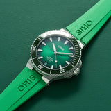 Oris Aquis Date Calibre 400 43.50mm Automatic Watch 01 400 7790 4157-07 4 23 47EB — A three-quarter angle view shows the stainless steel case profile, the green ceramic unidirectional rotating bezel with minutes scale in relief, and the screw-down crown at the 3 o’clock position. The brushed and polished case finishing is visible across the lugs and mid-case.