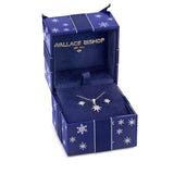 Front-on view of the Wallace Bishop Cubic Zirconia Star Earrings & Pendant Bauble Gift Set in Sterling Silver, reference 41GIFT264, shown in a navy snowflake-patterned gift box. The set includes a 15mm star pendant on a 500mm chain and a pair of 7mm star earrings, all pavé set with colourless round cubic zirconias.