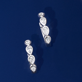 Front-on view of the Wallace Bishop Cubic Zirconia Bezel Huggies in Sterling Silver, reference 41PSBCZE3. Each petite huggie features bezel-set pear cut white cubic zirconias, with 8 stones in total between the pair.