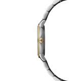 Side profile of the Raymond Weil Toccata Women’s 29mm Quartz Watch 5985-STP-97081, showing the slim 6.79mm round two-tone case with a fluted crown bearing the RW logo. The yellow gold PVD plated bezel and steel case sit above the folding clasp bracelet.