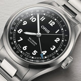Oris Big Crown Pointer Date 40mm Automatic Watch 01 754 7798 4064-07 8 20 06 — A close-up of the black dial highlights the large luminous Arabic numerals, railway-style minute track and the blue-tipped central pointer date hand indicating the date on the outer scale. The applied indices and hands are coated in Super-LumiNova for low-light legibility.