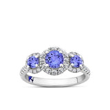 Front-on view of the Wallace Bishop Bluebird 0.38 TDW Round Tanzanite & Diamond Halo Ring in 9ct White Gold, reference 92RGTZ02WO. The trilogy ring features three natural round tanzanites, each surrounded by a halo of natural diamonds, with more diamonds on the shoulders of the band.
