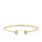 Front-on view of the Wallace Bishop Peridot Flexi Bangle in 9ct Yellow Gold, reference 93BGPBY, a cuff-style bangle measuring 50mm by 60mm. The bangle features a bezel-set 5x4mm natural emerald cut peridot on each side.
