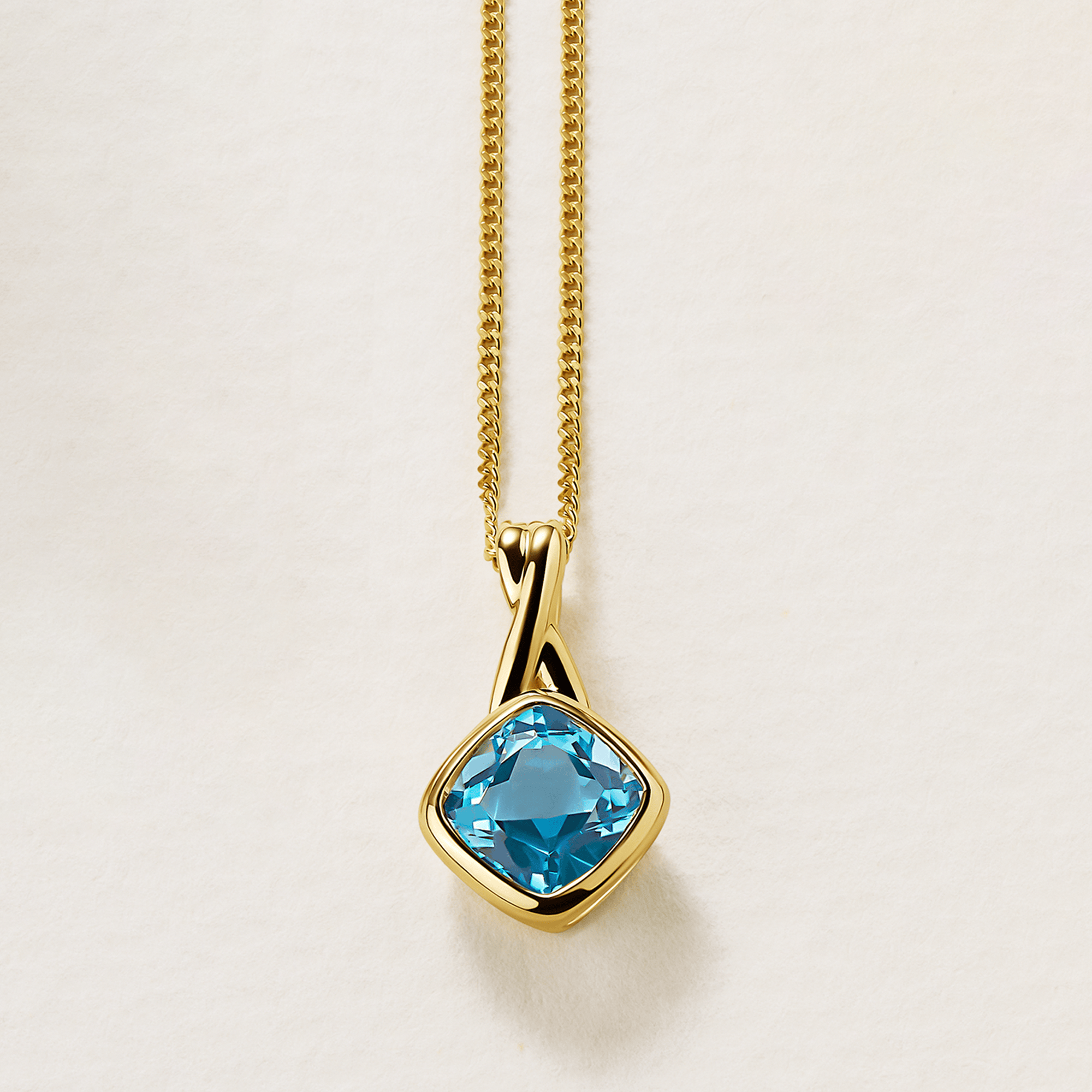 Cushion Cut Swiss Blue Topaz Twist Bezel Set Pendant in 9ct Yellow Gold