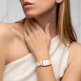 Woman wearing a rose gold watch