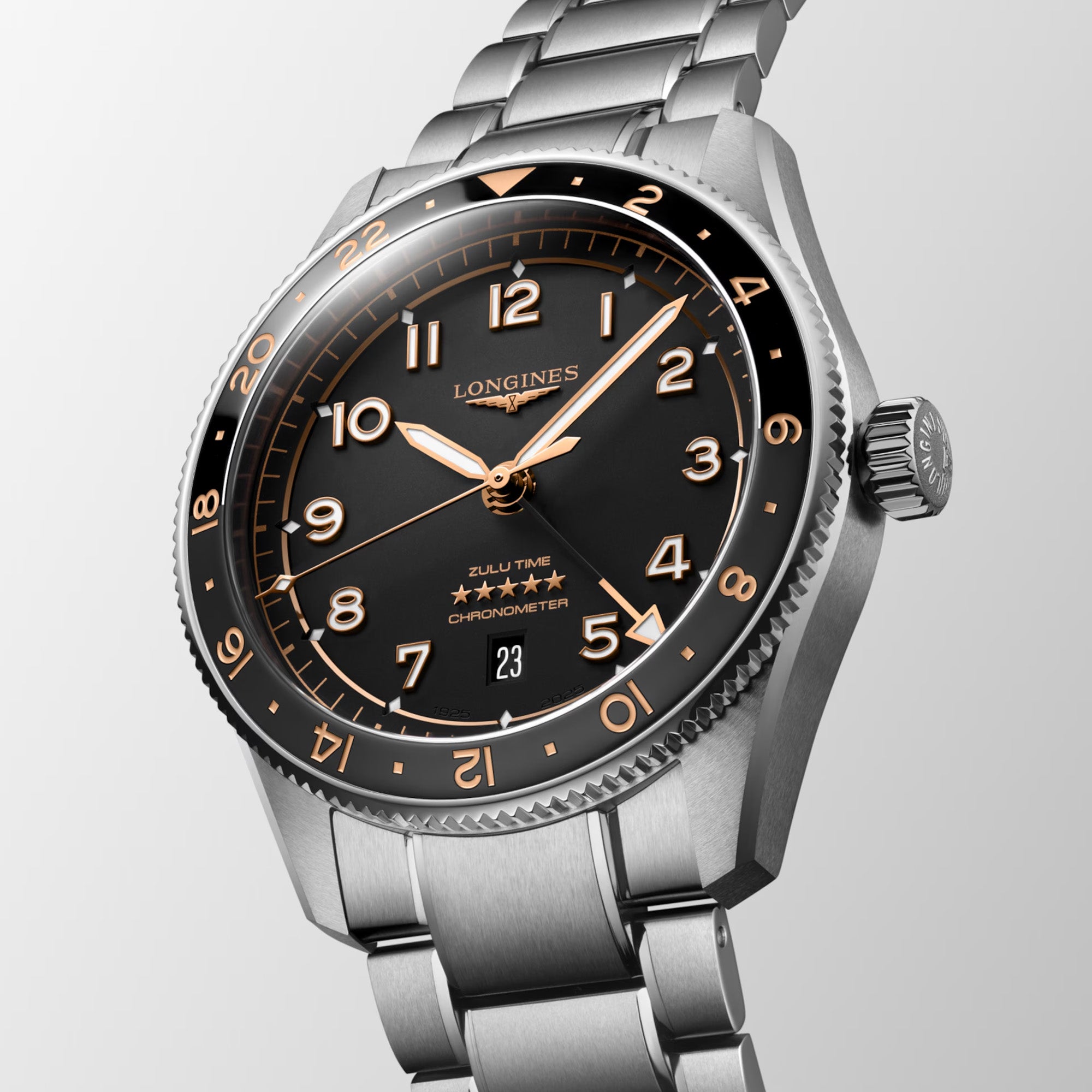 Silver Longines watch with black dial and rose gold accents