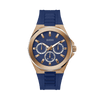 The Guess GW0799G2 is shown face-on, highlighting its 46mm rose PVD case and bold blue dial. The mineral crystal glass protects the dial while maintaining a clear, easy-to-read display.