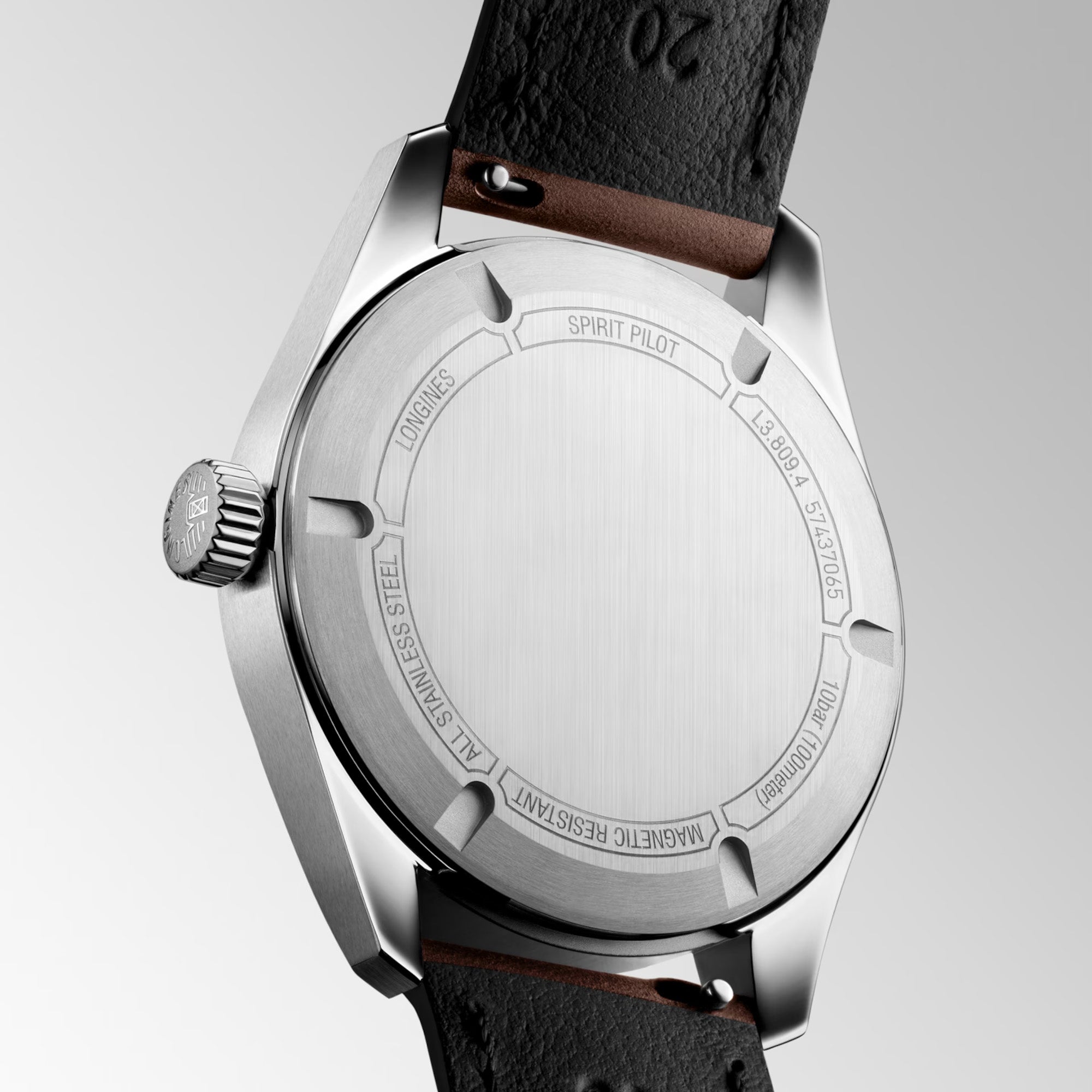 Back view of a Longines silver watch with a brown leather strap