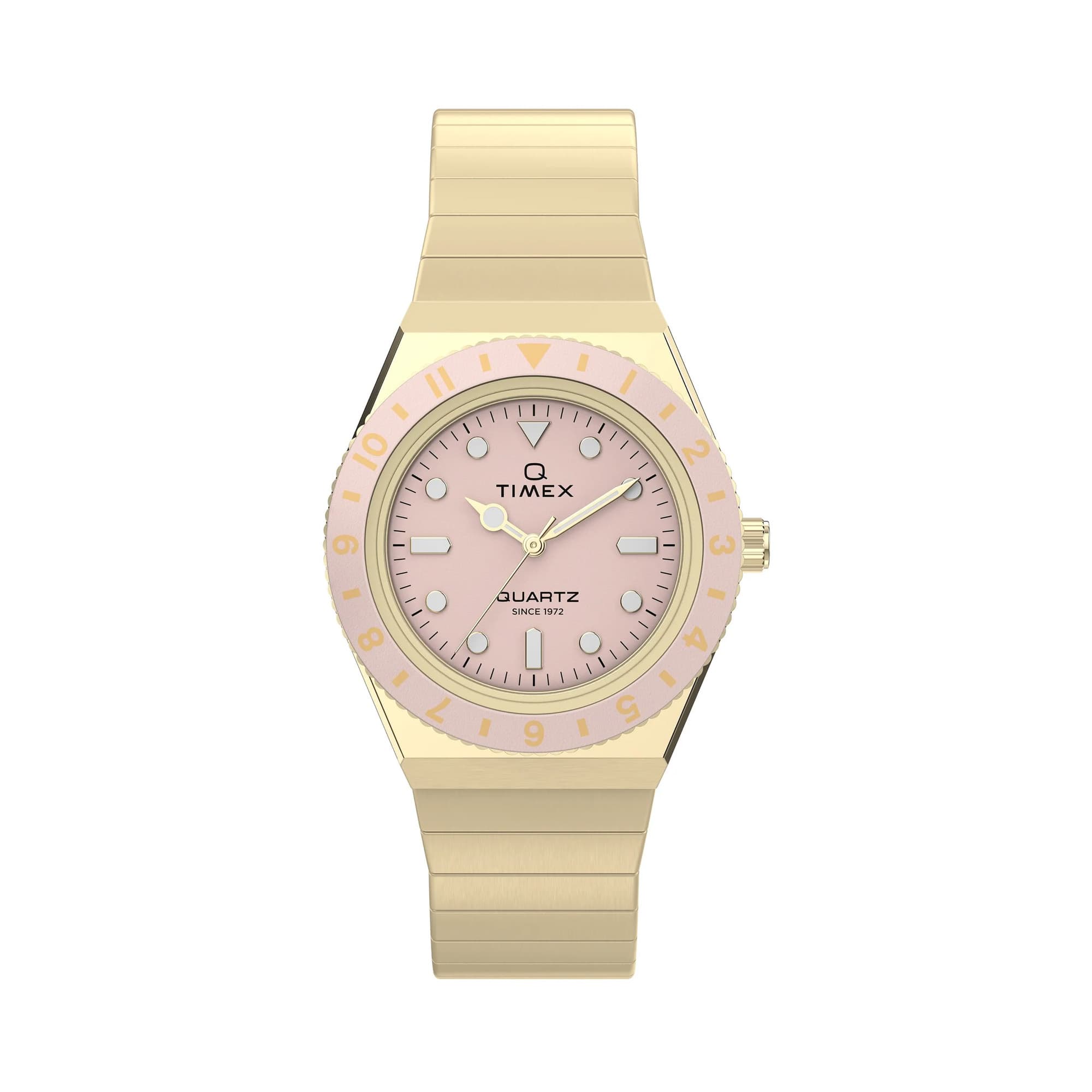 Gold-tone Timex Q Mini women’s watch with a pastel pink analog dial, luminous markers, 30mm stainless steel case, and matching expansion bracelet inspired by vintage 1970s styling.