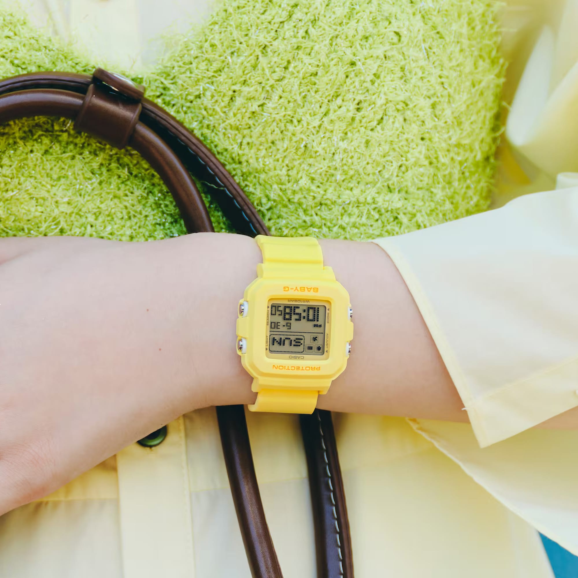 Casio Baby-G BGD10KH-9D digital watch with pastel yellow resin band on wrist