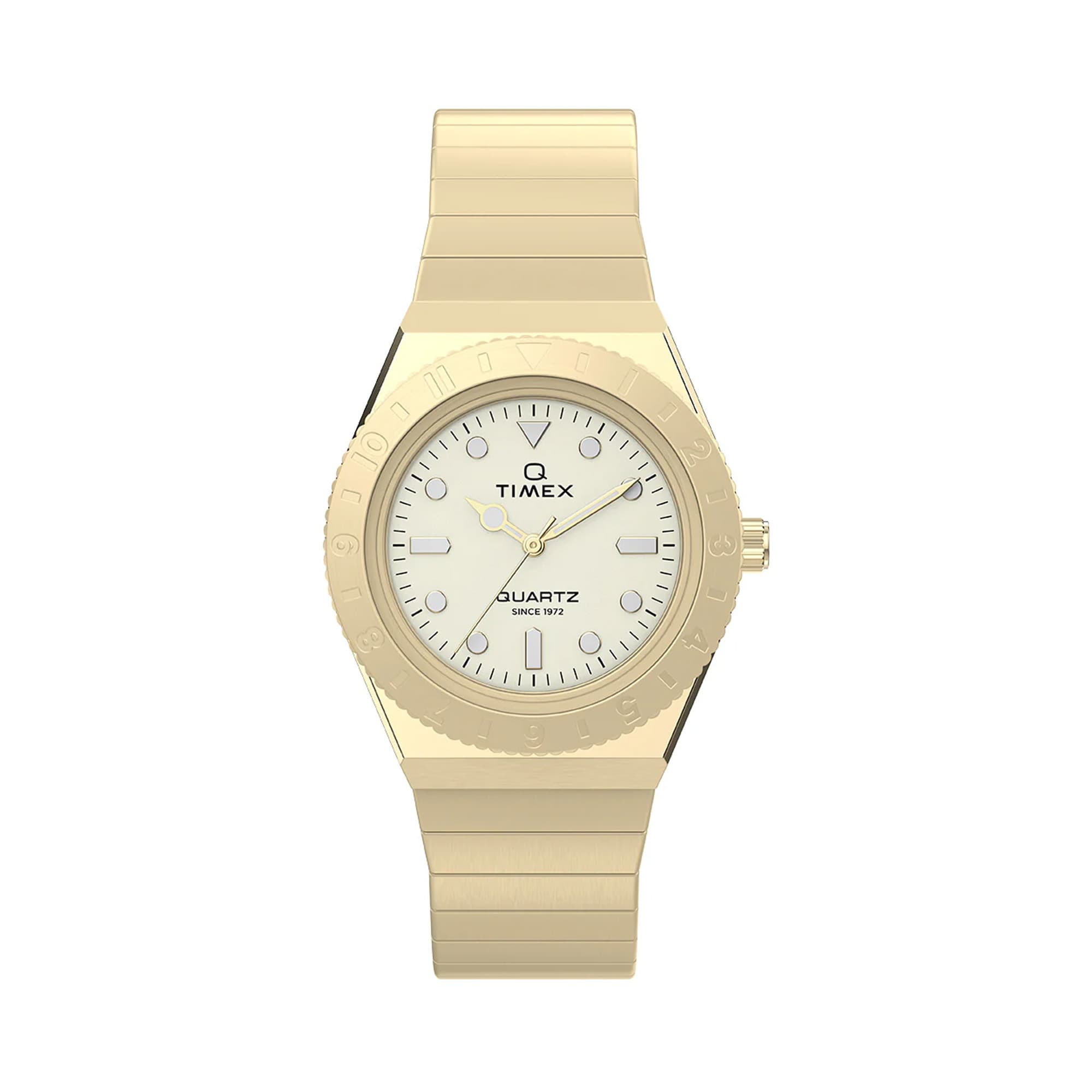 Gold-tone Timex Q Mini women’s watch featuring a 30mm stainless steel case, cream analog dial, luminous hour markers, and a matching expansion bracelet with vintage-inspired styling.