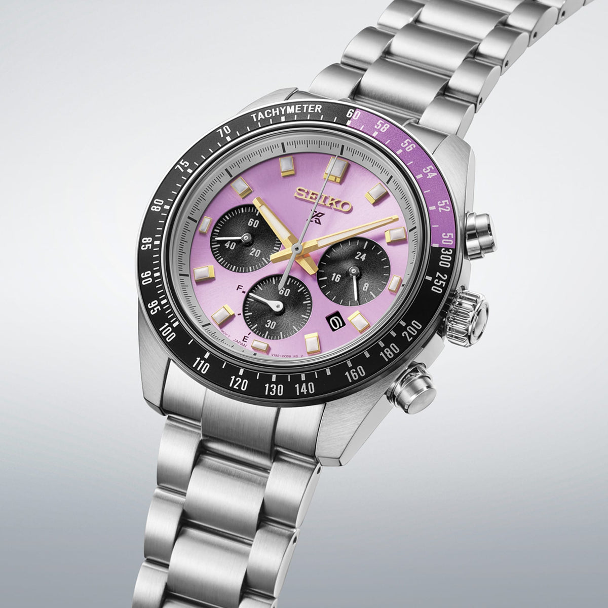From this angle, the Seiko Prospex Speedtimer Solar Chronograph Men's 41.40mm Watch HBJ005J shows the Edo purple dial's gold accents and bi-colour bezel together with the stainless steel case and bracelet.