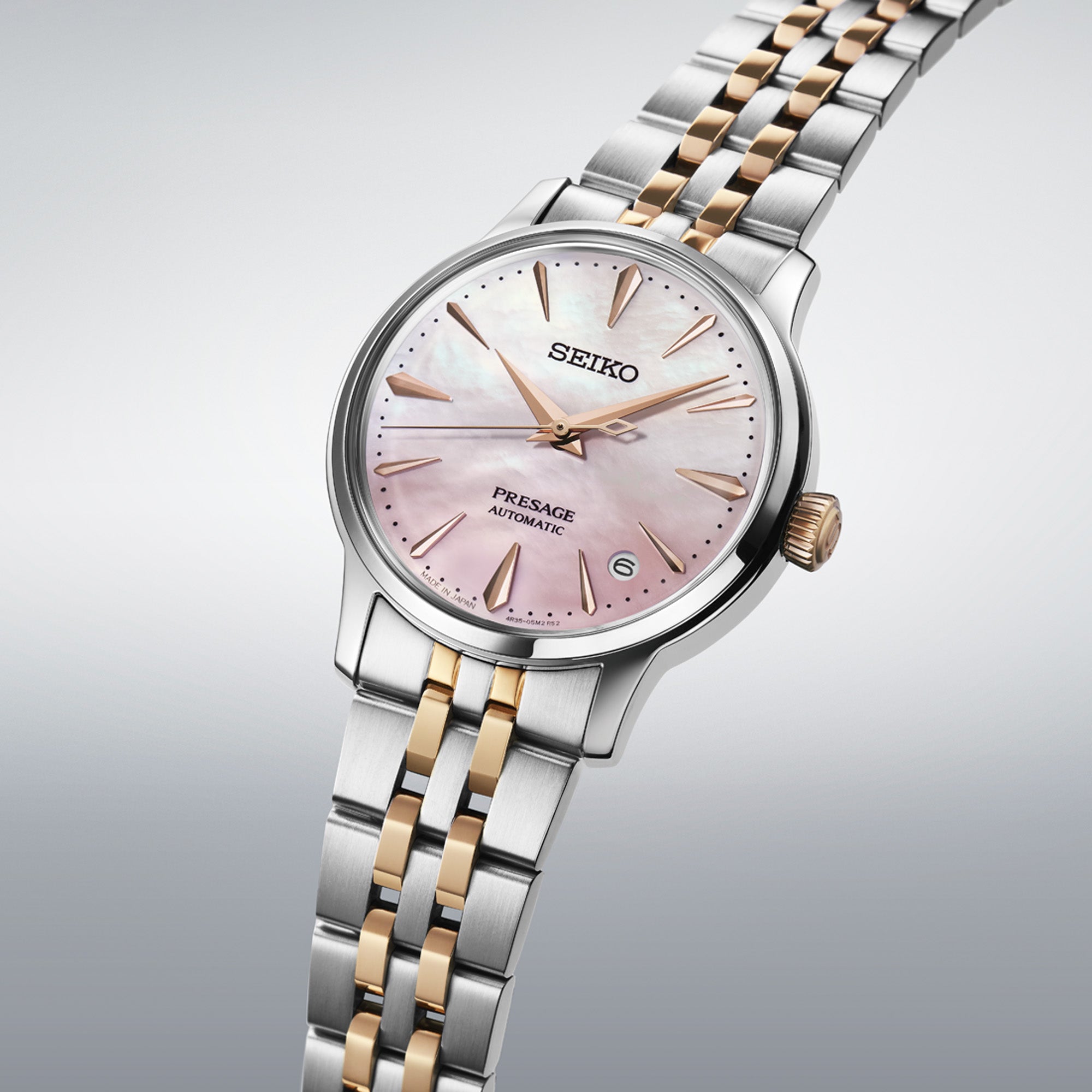 Seiko watch with pink dial and two-tone metal bracelet
