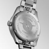 Silver Longines watch case back with engraved brand logo