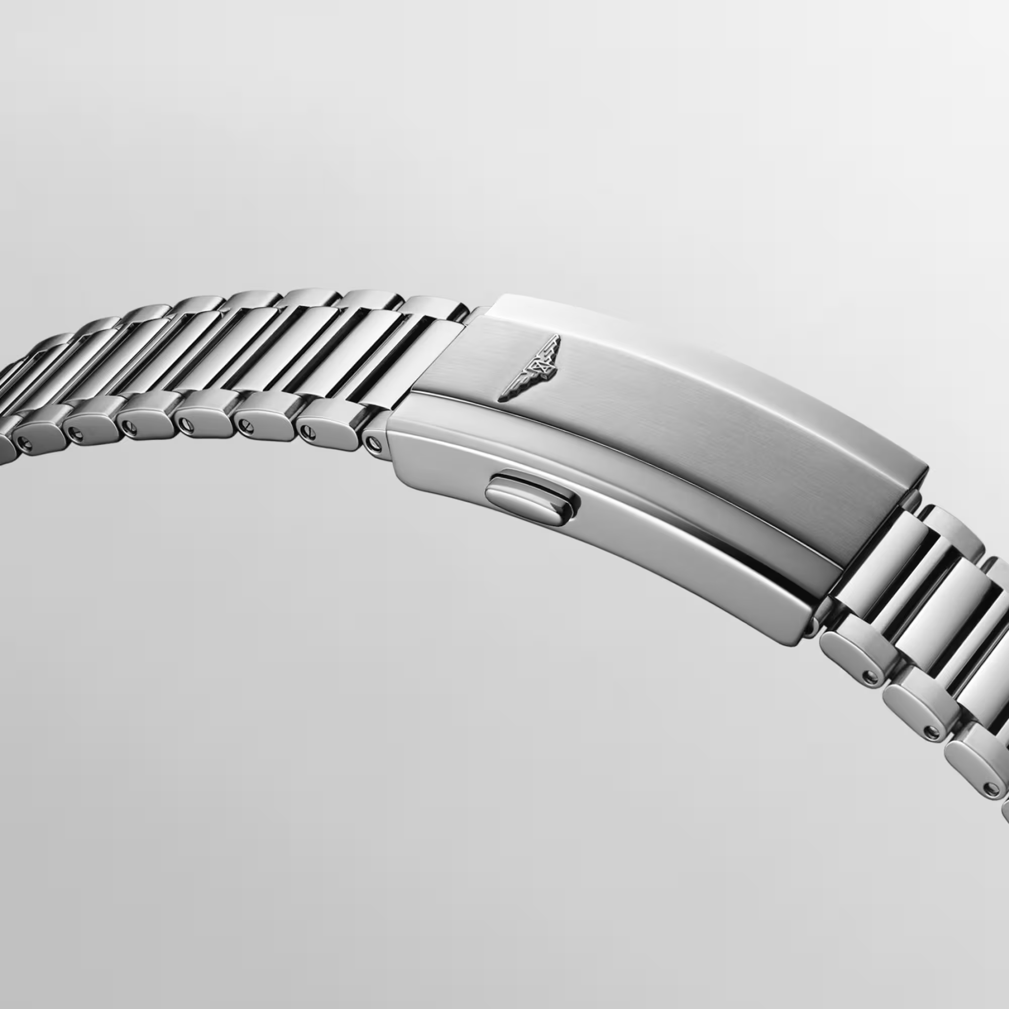 Silver Longines watch with black dial on a light gray background - 5