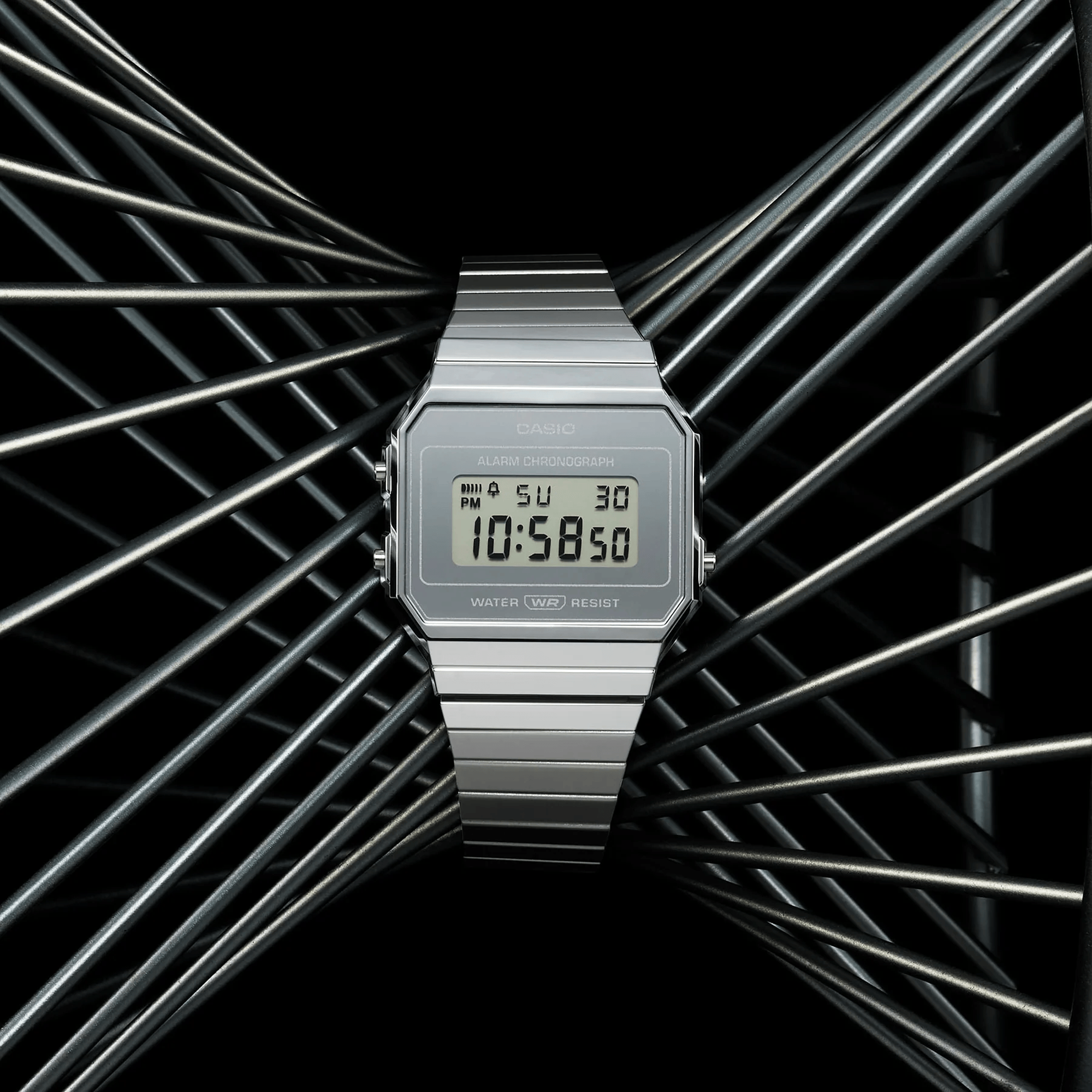 Casio Vintage A700WEV-7A front view, showcasing the ultra-slim 6mm monochromatic silver rectangular case with chrome-plated resin finish, clean silver digital LCD dial, and self-adjustable stainless steel bracelet — pure Casio Vintage sophistication at its most refined.