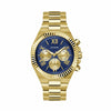 The Guess GW0703G6 is shown face-on, highlighting its 44mm gold-tone case and blue multi-function dial. The coin-edge bezel and three sub-dials add depth and detail to the overall design.