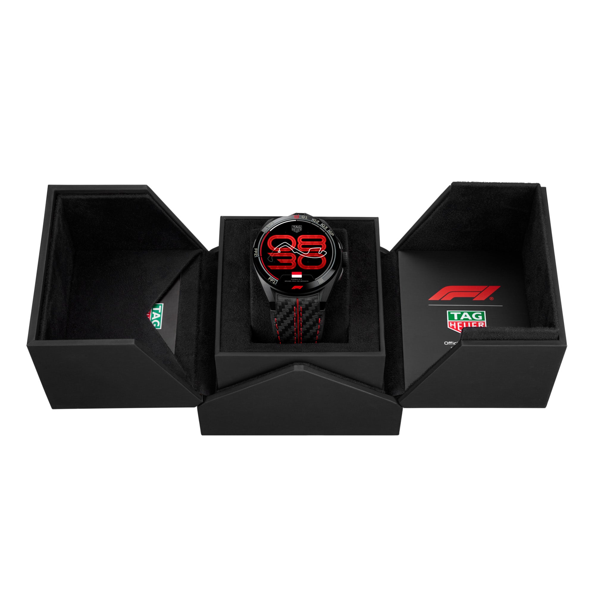 Black Tag Hauer smartwatch with red accents in a watch box