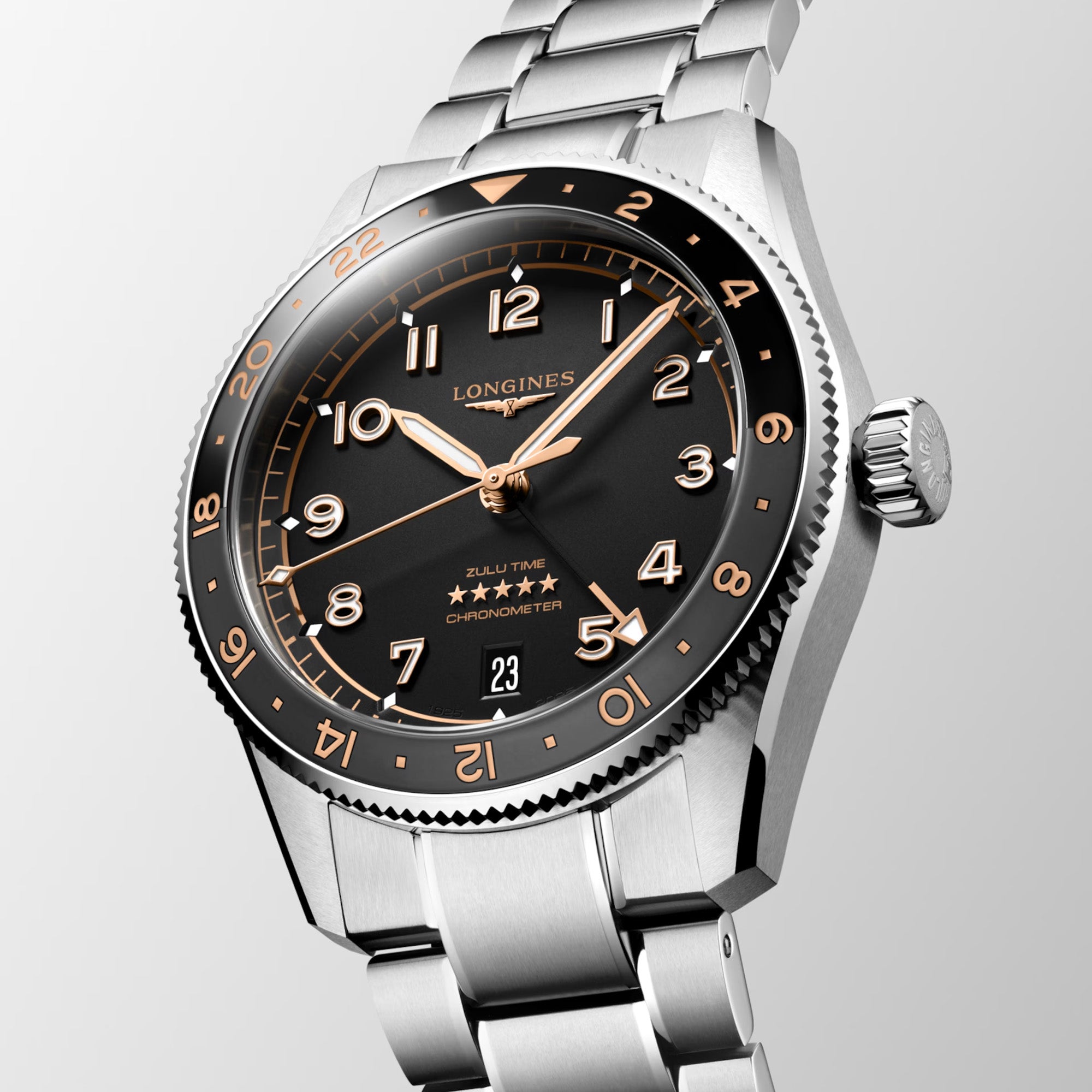 Silver Longines watch with black dial and rose gold accents