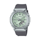 Casio G-SHOCK GMS2110-3AD analogue digital watch with grey bio-based resin band, silver stainless steel bezel, and green dial.