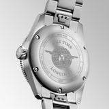 Silver Longines watch case back with engraved brand details