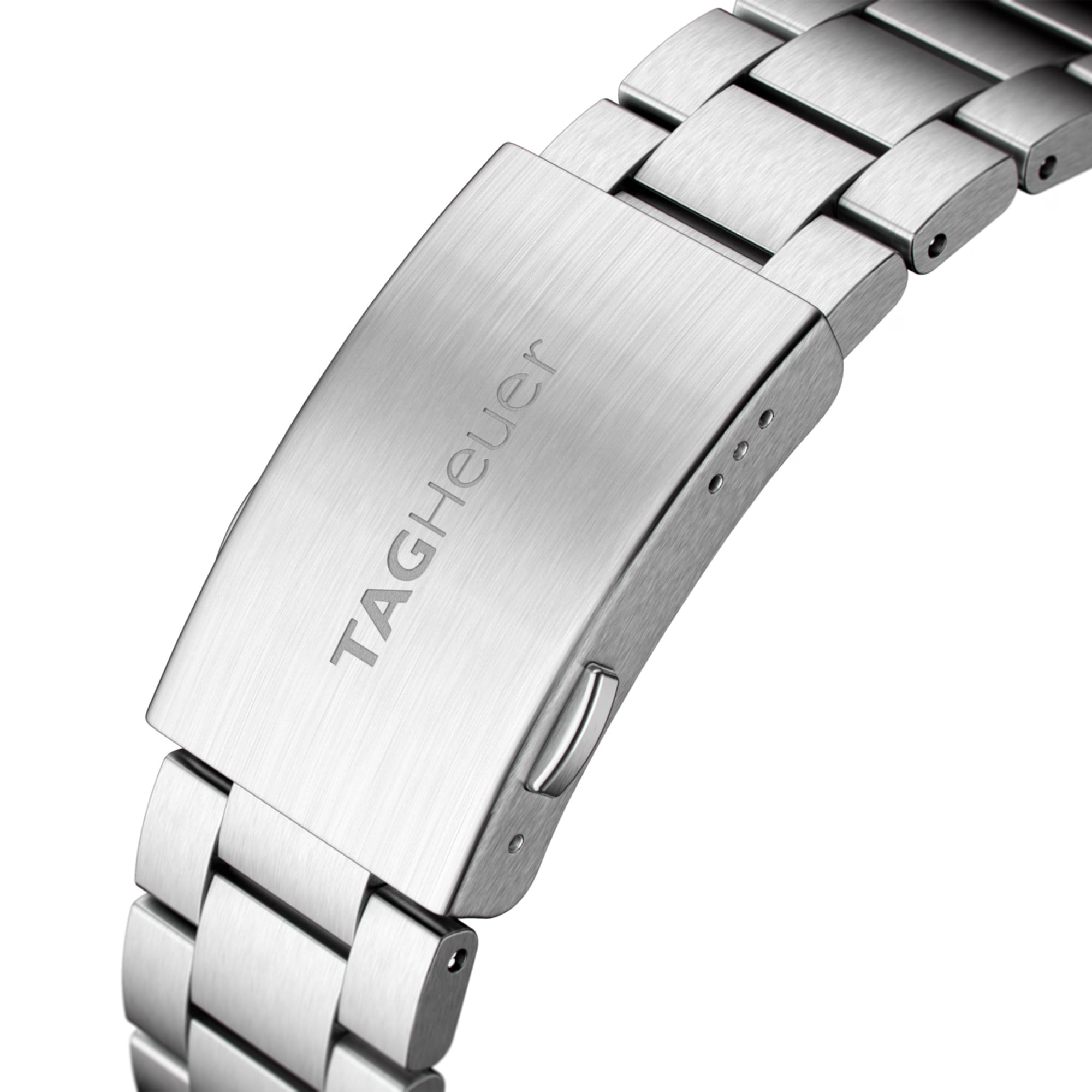 TAG Heuer Formula 1 Date WAZ1110.BA0875 photographed in close-up focusing on the steel bracelet's polished and brushed link detailing. The case is partially visible at the top of the frame, connecting to the bracelet via the lugs.