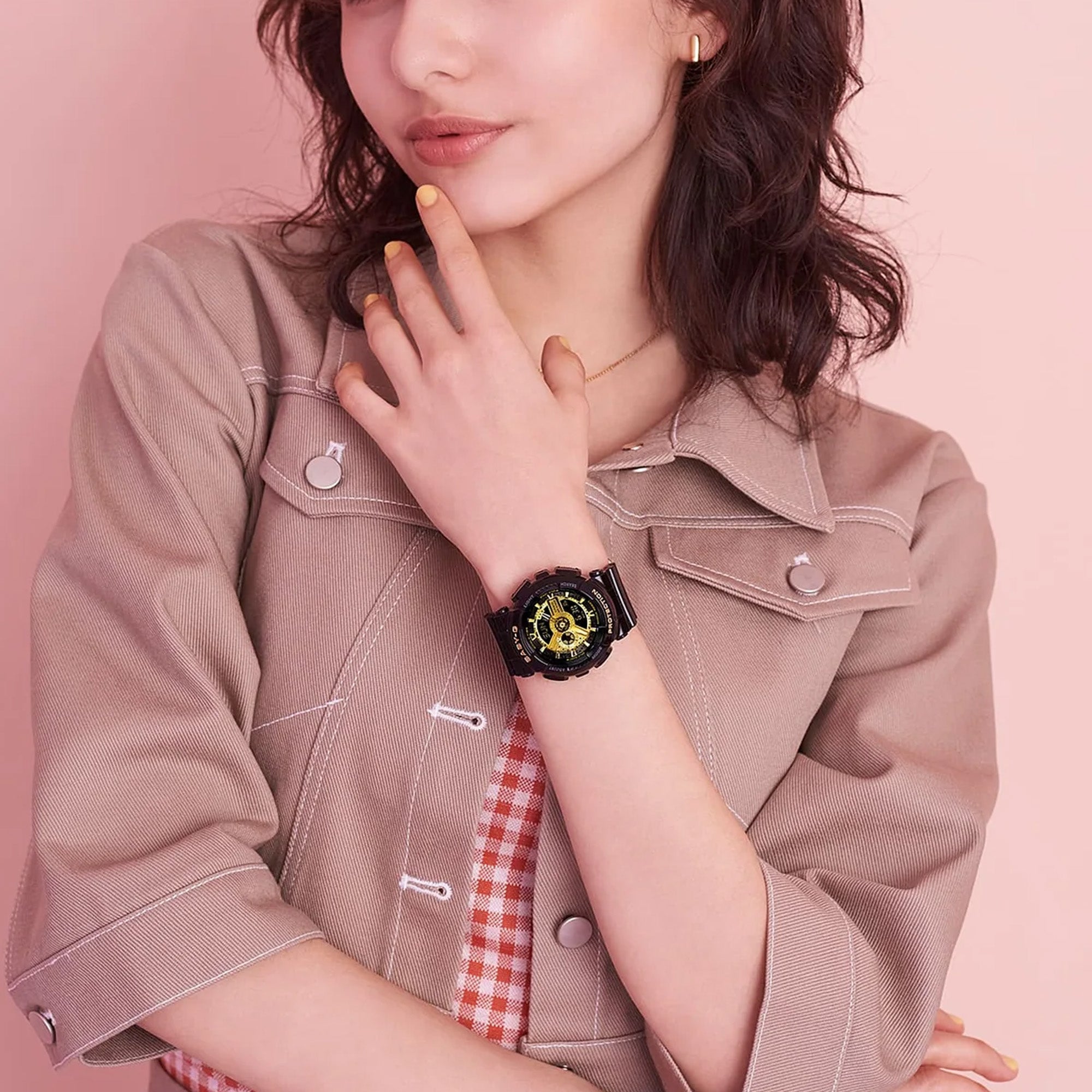 Casio Baby-G BA110X-1A women's watch front view, featuring a 46.3mm all-black round resin case with a deeply layered three-dimensional dial, gear-inspired index markings, analogue hands, and a lower digital LCD display window.