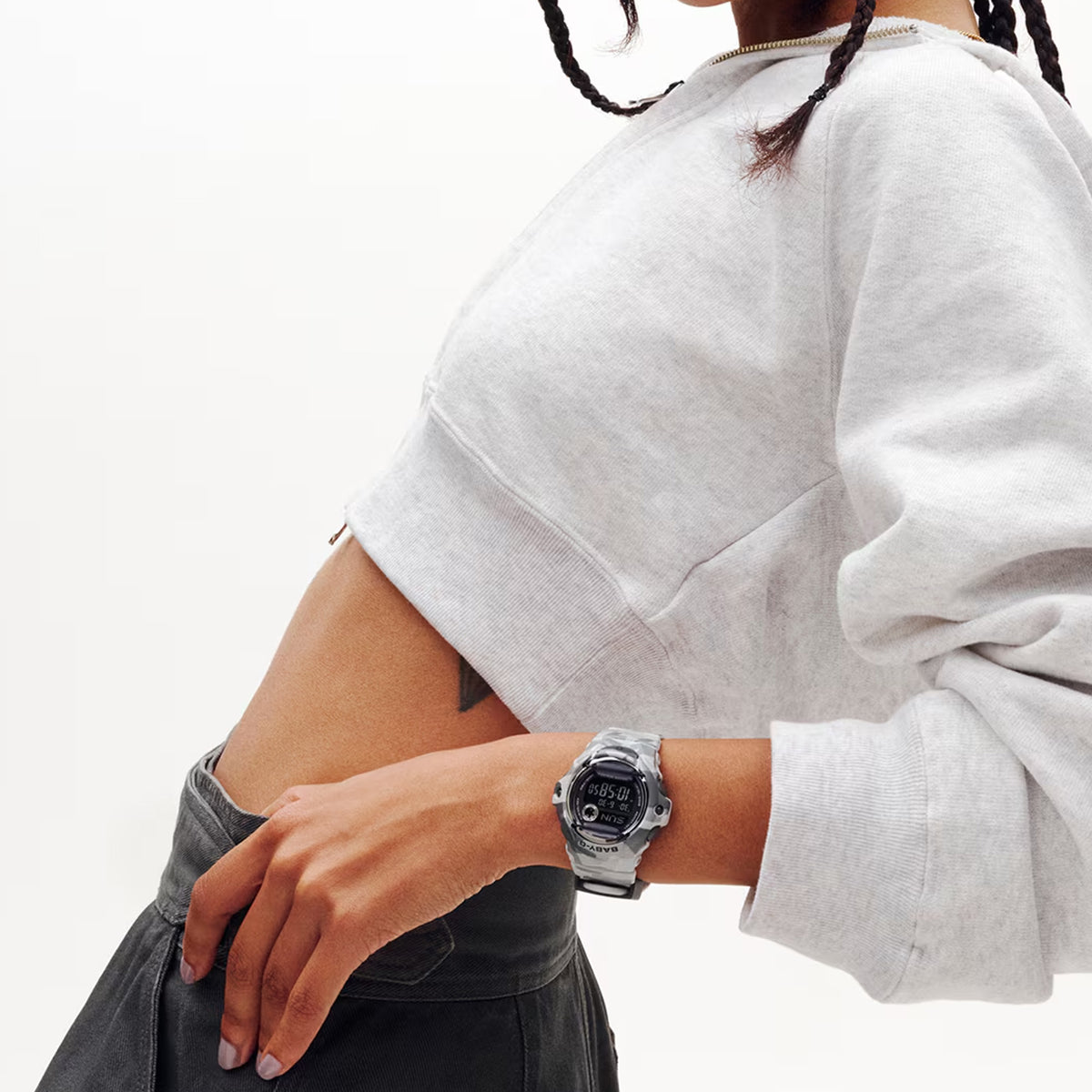 The Casio BABY-G BG169CMB-8D Digital Women's Watch worn on the wrist to show scale and fit. The grey camo bezel and metallic finish suit an active, everyday lifestyle.